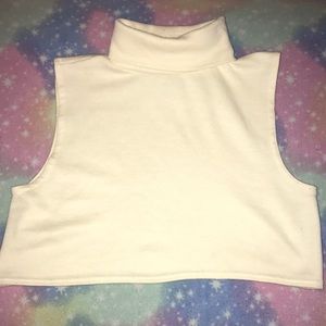 Cropped white sleeveless turtleneck